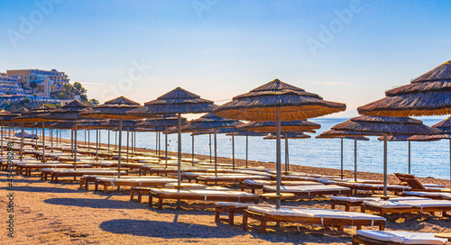 Fototapeta Naklejka Na Ścianę i Meble -  Sun loungers and parasols on the beach Kos island Greece.