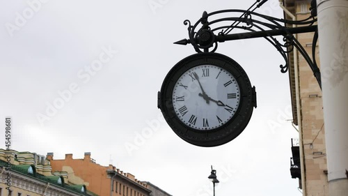 old clock on the street of the city