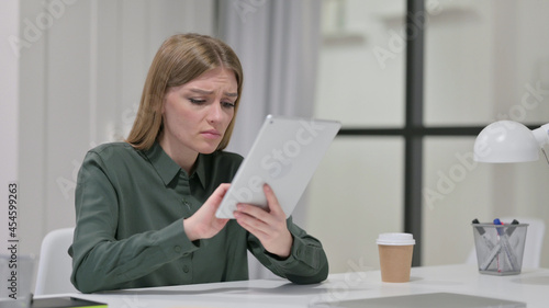 Disappointed Young Woman Reacting to Loss on Tablet 