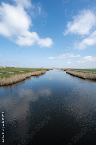 Quadro su tela Dutch landscape, polders and water channels in Zeeland, Netherlands