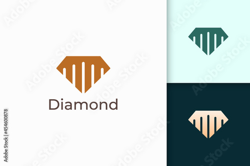 Luxury gem or jewel logo in diamond shape with gold color