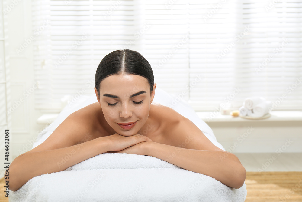 Beautiful young woman relaxing in spa salon Beautiful young woman relaxing in spa salon