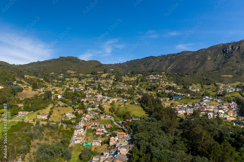 Aerial view of houses between the ascent of a mountain in the town of Sopo in the department of Cundinamarca in Colombia.