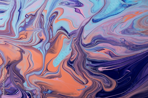 Beautiful liquid texture of the nail polish.Pink and purple colors.Multicolored background with copy space.Fluid art pour painting technique.Good as digital decor.
