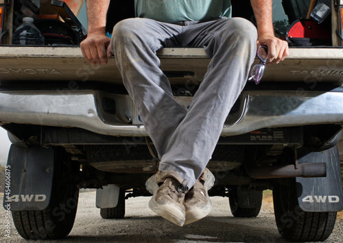 Sitting on a tailgate photo