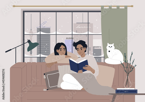 Cozy winter interior, a couple reading a book together, Christmas holidays