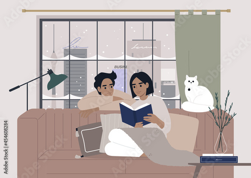 Cozy winter interior, a couple reading a book together, Christmas holidays