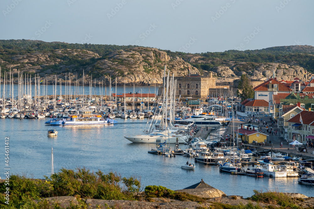 Marstrand island panorama Scenery with Harbour and boats in the canal and Carlsten's fortress against the blue sky in west caost of Sweden.