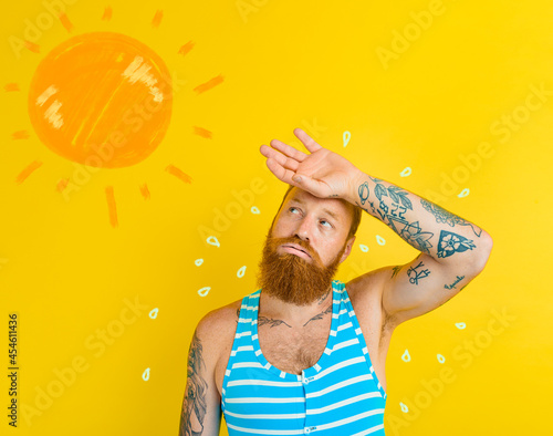 Man in swimsuit sweats due to too hot