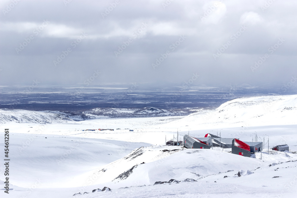Winter view from the foot of the Avacha volcano on the building of the Ministry of Emergency Situations in the Natural Park Winter view from the foot of the Avacha volcano on the building of the Ministry of Emergency Situations in the Natural Park