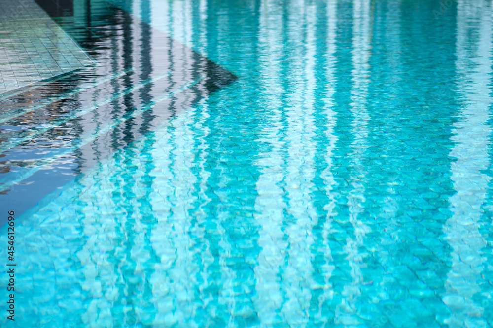 Pool edge. Blue water. Swimming pool in a residential complex