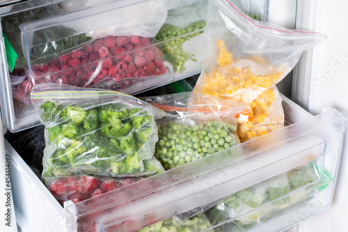 Frozen food in the freezer. Frozen vegetables, ready meals in the freezer. Frozen meat, food and vegetables.