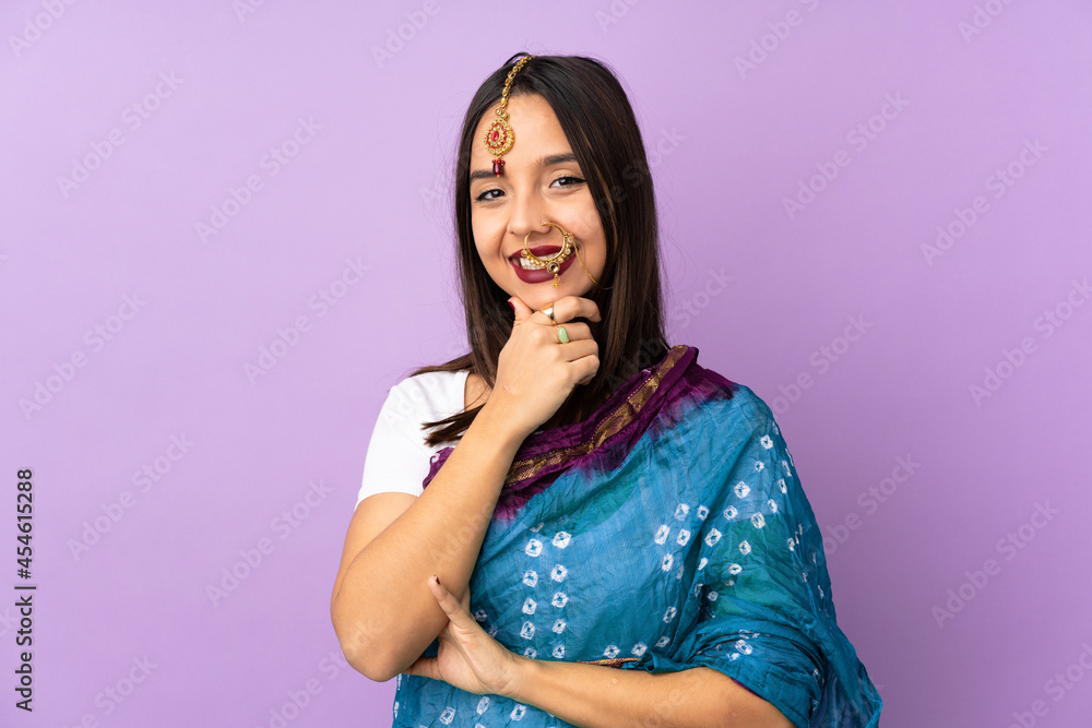 Young Indian woman isolated on purple background happy and smiling Young Indian woman isolated on purple background happy and smiling