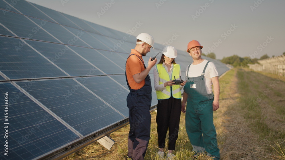 Technician and investor Using Infrared Drone Technology to Inspect Solar Panels and Wind Turbines in Solar cell Farm, Solar cells will be an important renewable energy of the future. Solar panel Technician and investor Using Infrared Drone Technology to Inspect Solar Panels and Wind Turbines in Solar cell Farm, Solar cells will be an important renewable energy of the future. Solar panel