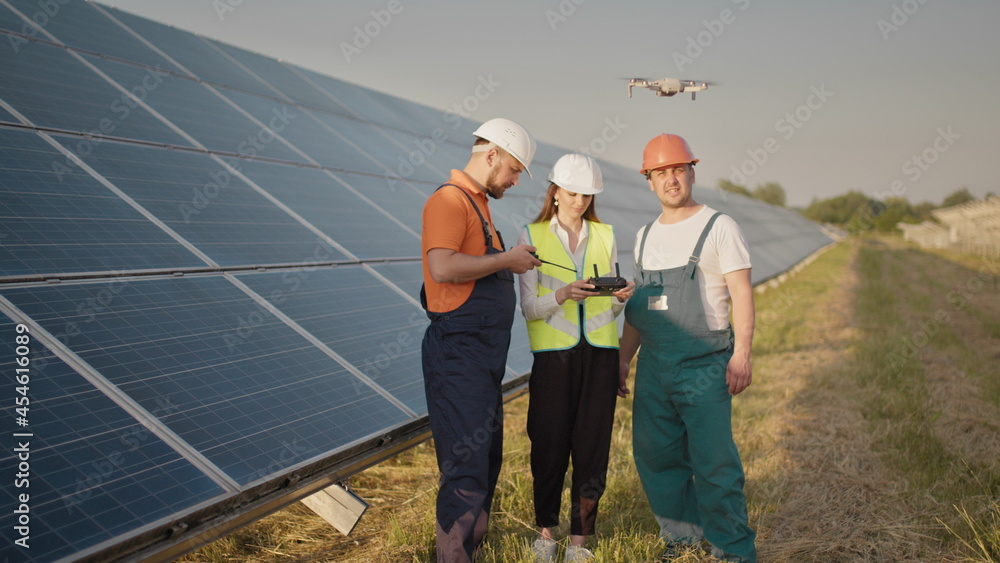 Technician and investor Using Infrared Drone Technology to Inspect Solar Panels and Wind Turbines in Solar cell Farm, Solar cells will be an important renewable energy of the future. Solar panel Technician and investor Using Infrared Drone Technology to Inspect Solar Panels and Wind Turbines in Solar cell Farm, Solar cells will be an important renewable energy of the future. Solar panel