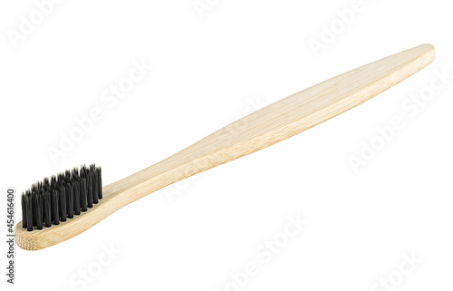 Bamboo wood toothbrush with black brush bristles isolated on a white background. Natural bamboo toothbrush.