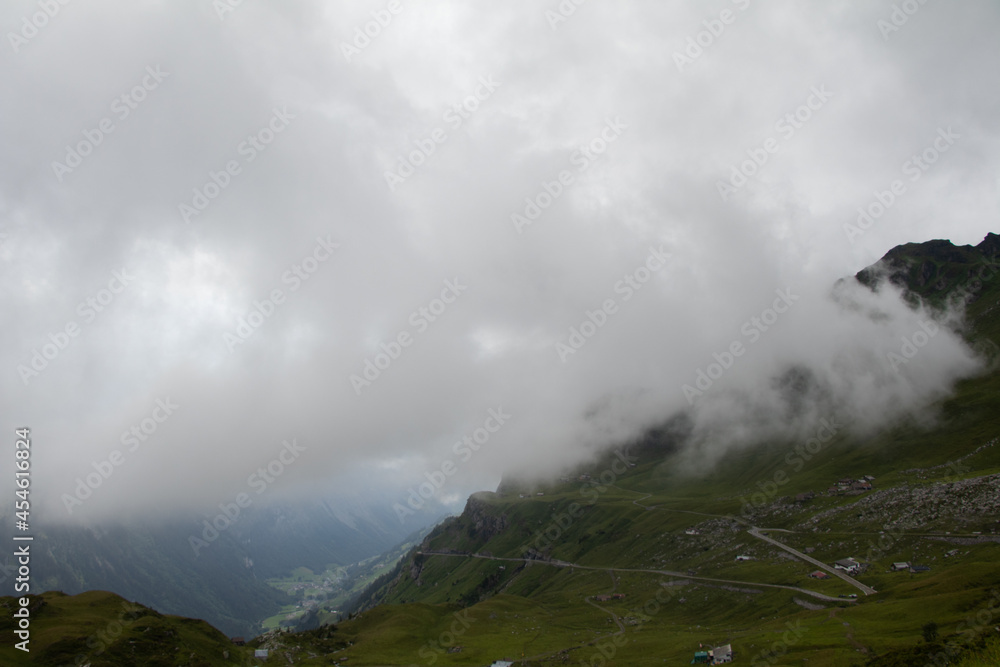 Amazing Landscape in the hearth of Switzerland. Epic scenery with the clouds and fog. Wonderful sunrays through the clouds and later an amazing sunset and sunrise. Perfect roadtrip through Switzerland