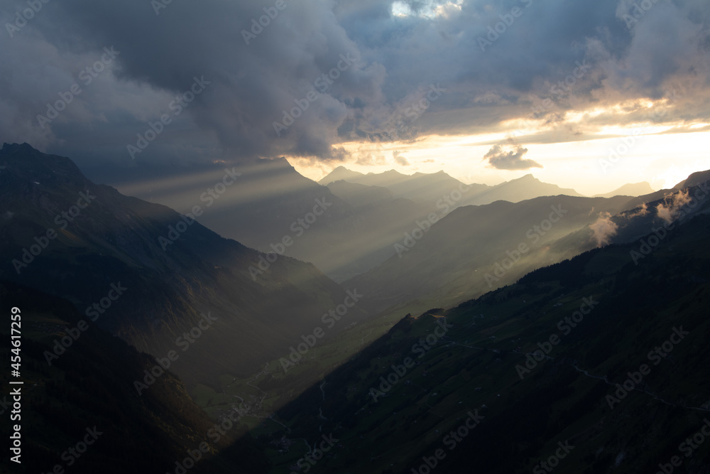 Amazing Landscape in the hearth of Switzerland. Epic scenery with the clouds and fog. Wonderful sunrays through the clouds and later an amazing sunset and sunrise. Perfect roadtrip through Switzerland