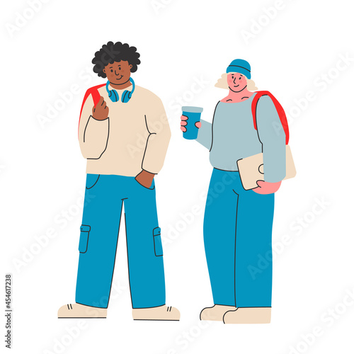 Young man and woman in modern casual clothes with a backpack, laptop and headphones. College students or high school students. Back to school.