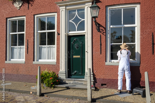 Tableau sur toile Painter at work in Edam, Noord-Holland province, The Netherlands
