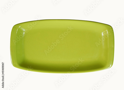 Old rectangular green dish with small cracks isolated on white © hacohob