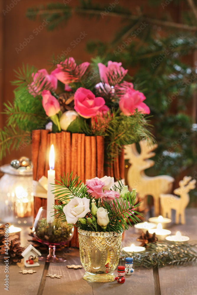Christmas decorations with flowers, candles and fir.
