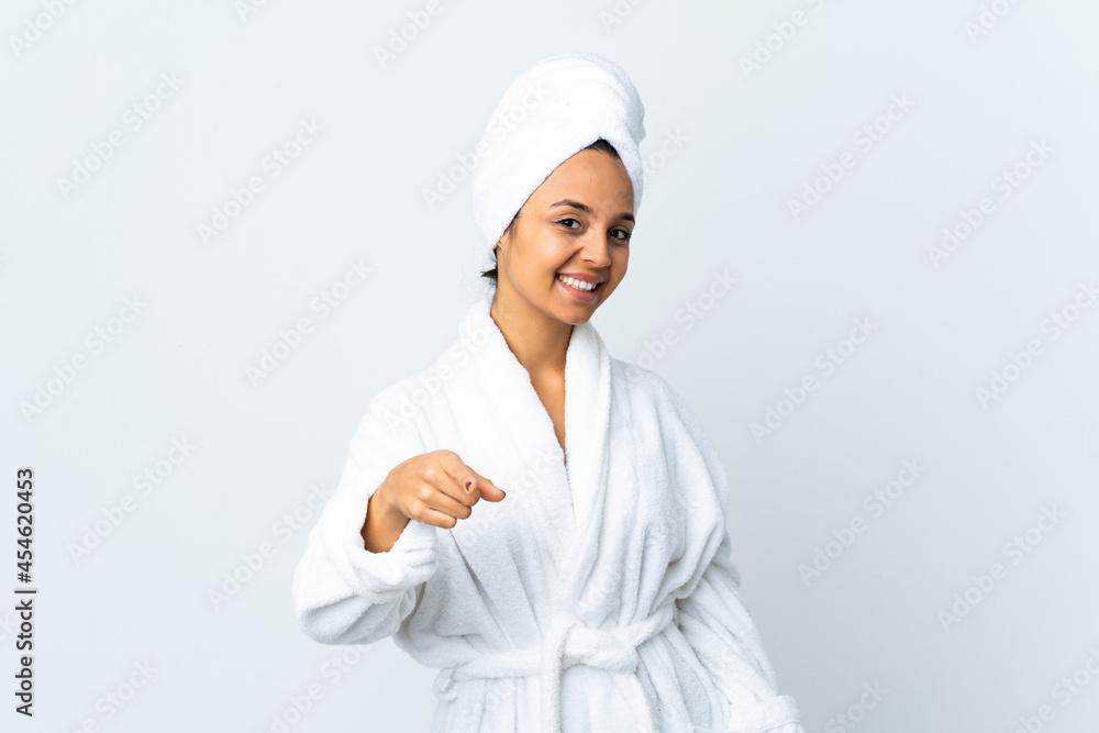 Young woman in bathrobe over isolated white background pointing front with happy expression Young woman in bathrobe over isolated white background pointing front with happy expression