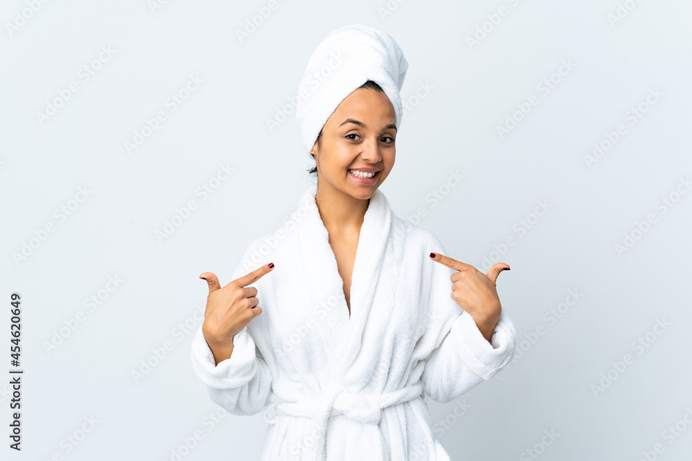 Young woman in bathrobe over isolated white background giving a thumbs up gesture Young woman in bathrobe over isolated white background giving a thumbs up gesture