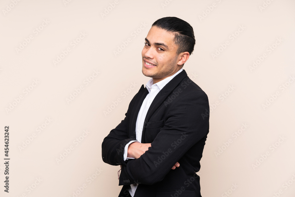 Asian business man isolated on beige background looking to the side Asian business man isolated on beige background looking to the side