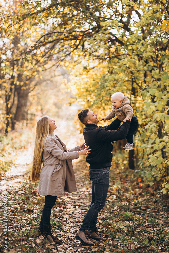 Family with a little son in autumn park Family with a little son in autumn park