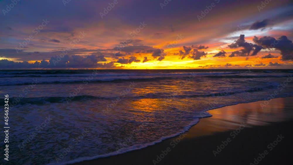 Nature video sunset The scenery, beaches, natural beauty and wonders. sunset in the sea On a beautiful day, the sky is golden yellow and the sea waves wash on the beautiful soft sandy beach Nature video sunset The scenery, beaches, natural beauty and wonders. sunset in the sea On a beautiful day, the sky is golden yellow and the sea waves wash on the beautiful soft sandy beach
