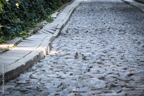 Cobblestone street with collapsed kerb