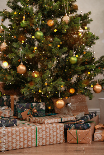 Close-up of Christmas presents are on the floor under the Christmas tree