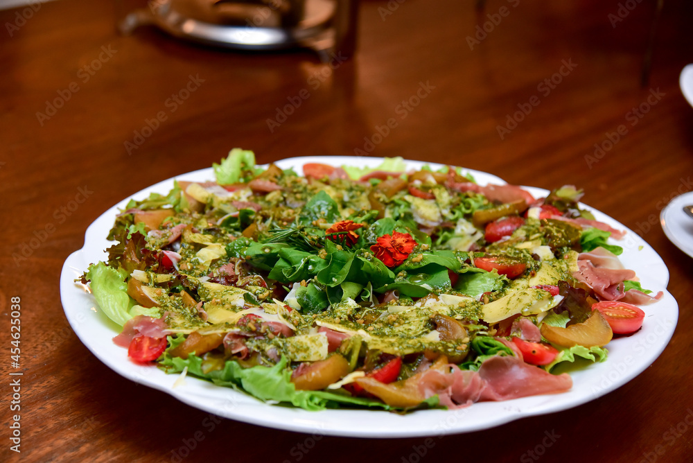 salad with parma ham and vegetables, cold dish, cold platter,accompaniment to wine, snack to wine salad with parma ham and vegetables, cold dish, cold platter,accompaniment to wine, snack to wine