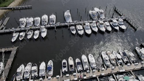 Drone parallax over boating dock with many boats photo