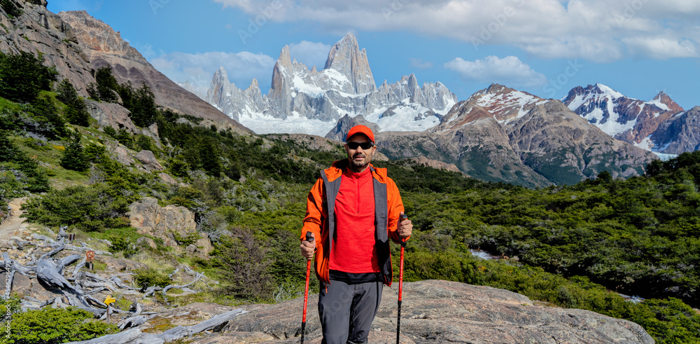 latin hiker in the mountains with Monte Fitz Roy background in Patagonia, Argentina