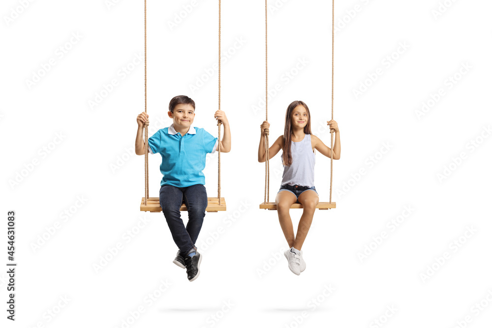 Boy and girl sitting on swings and looking at camera
