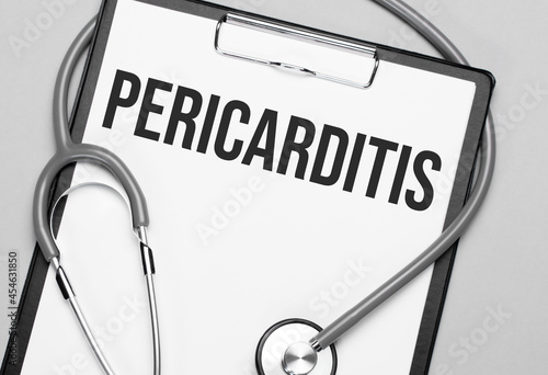 The words Pericarditis is written on white paper on a grey background near a stethoscope. Medical concept photo