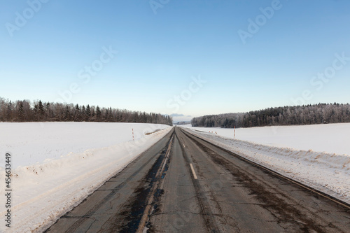paved road covered with snow in winter © rsooll