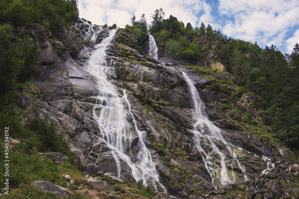 Low angle view of Nardis waterfalls (Trentino, South Tyrol, Italy). They are over 130 metres high and are part of Dolomites (Unesco site).