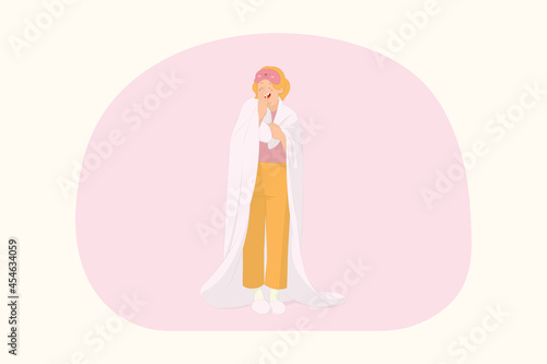 Young sleepy woman relaxing at home wrap covered under blanket duvet yawning concept