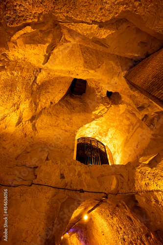 Deep and long undergrounds caves for making champagne sparkling wine from chardonnay and pinor noir grapes in Reims, Champagne, France photo