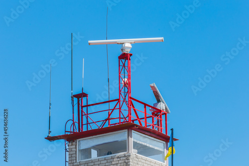 Safety and security post or tower pier sea symbol and landmark against the blue sky