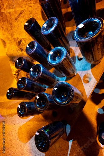 Deep and long undergrounds caves for making champagne sparkling wine from chardonnay and pinor noir grapes in Reims, Champagne, France photo