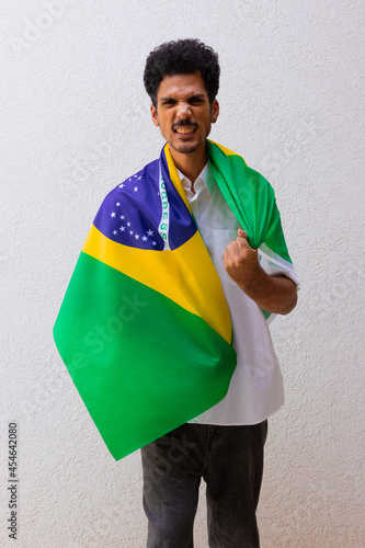 Business or Worker Holding a Brazil Flag Isolated On White. Flag and Independence Day Concept Image.