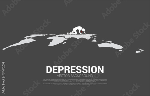silhouette of businessman crawling on world map. Concept for depression business in work.