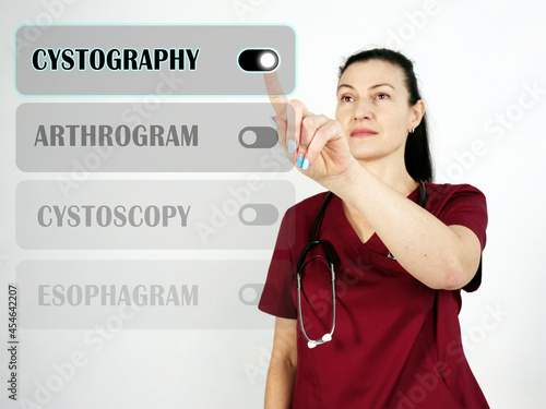  CYSTOGRAPHY inscription on the screen. Close up therapist hands holding black smart phone. photo