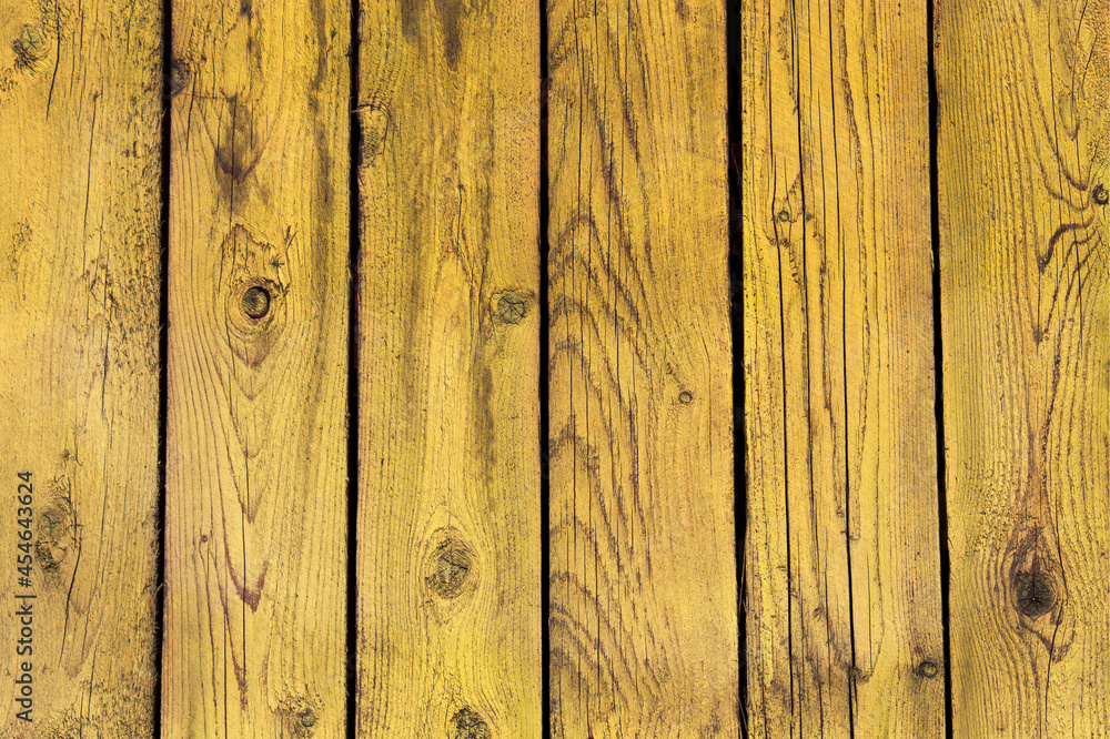 Naklejka premium Vertical boards in yellow. Yellow fence. Background