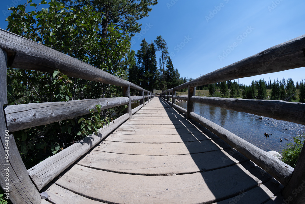 Bridge walkway along the String Lake trail in Grand Teton National Park, unique fisheye lens view Bridge walkway along the String Lake trail in Grand Teton National Park, unique fisheye lens view