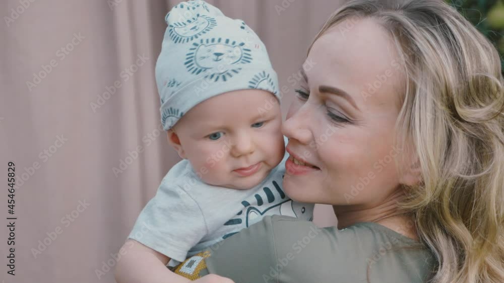 Loving, happy tender mom holding adorable cute baby boy hugging little baby. Loving, happy tender mom holding adorable cute baby boy hugging little baby.